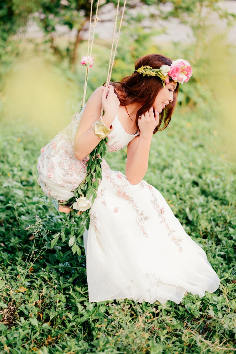 cuckoo cloud concepts david and jaja enchanted engagement session wooden swing lush greens pink flowers-46