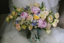 A mix of pastels in pink, peach and lavender for Vanessa's carnival-inspired wedding